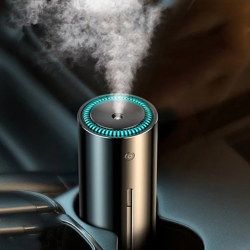 Black aluminium alloy car diffuser humidifier with USB cable on a desk.