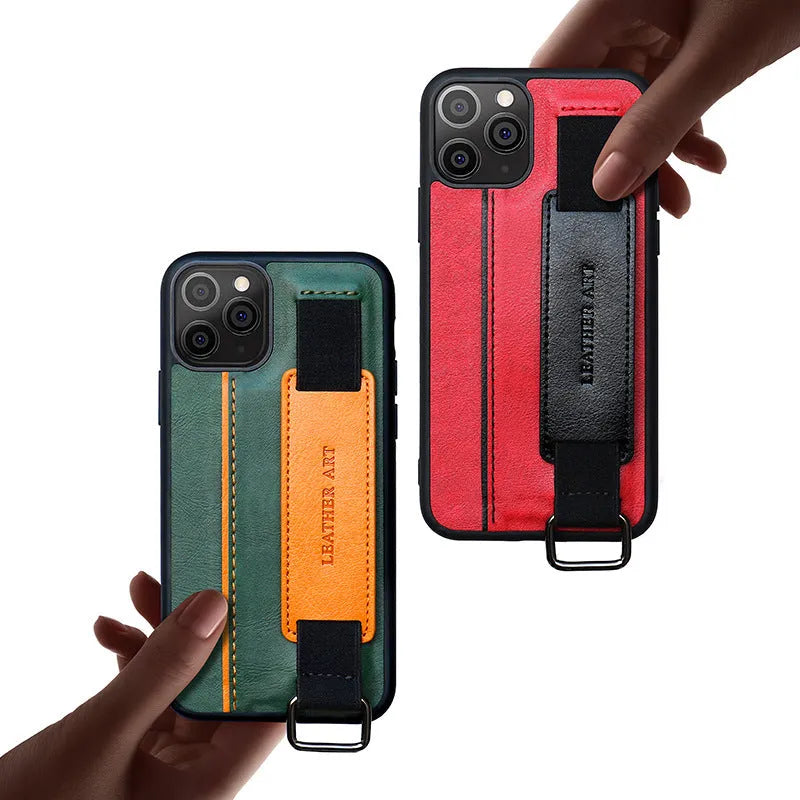 Brown imitation leather iPhone case with a wrist strap, showing decorative stripes and stitching.