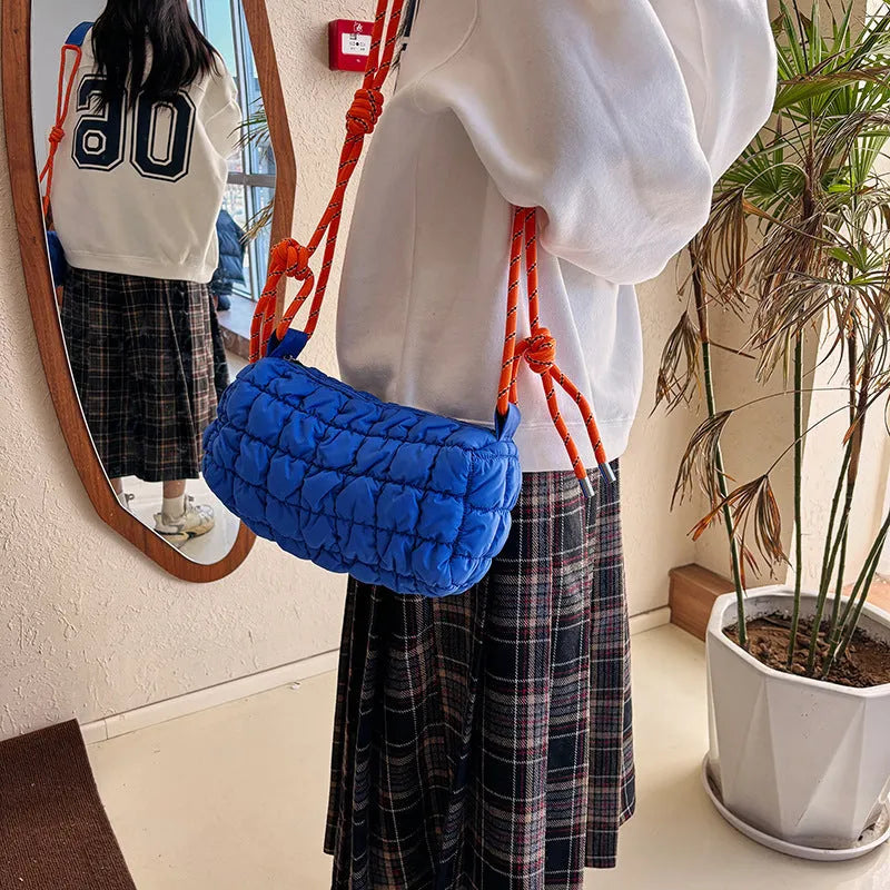 Women's soft nylon messenger bag in pillow shape with rhombus pattern and crossbody strap.