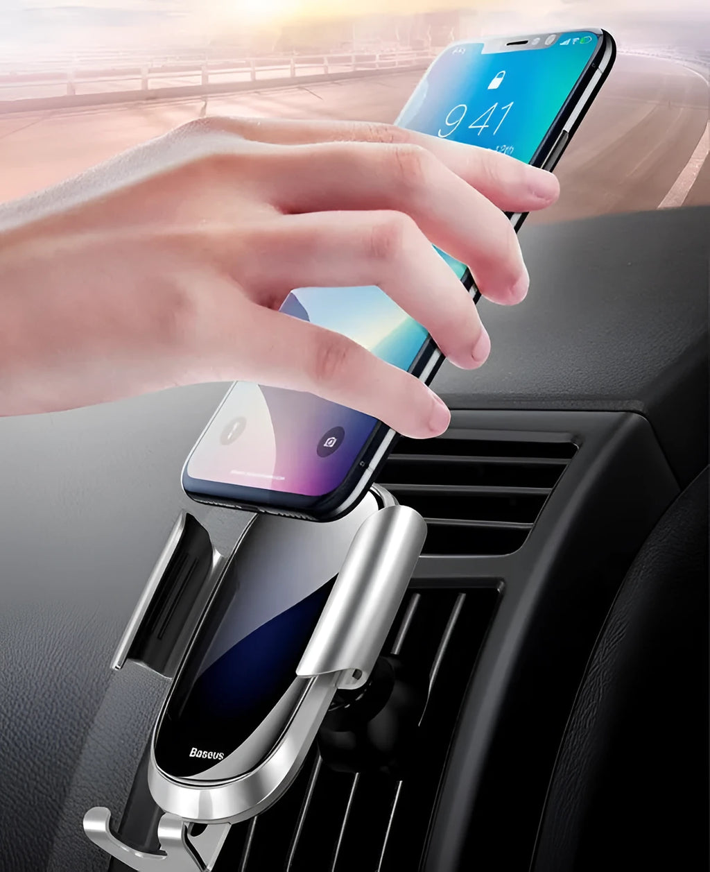 Universal car smartphone mount with adjustable clamp on a car air vent, showing 360-degree rotation.