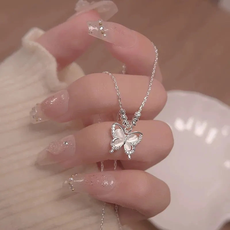 Silver butterfly necklace with square opal pendant on adjustable cross chain
