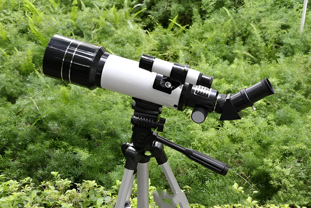 Dark blue children's monocular astronomical telescope on a tripod with 16X-66X magnification.