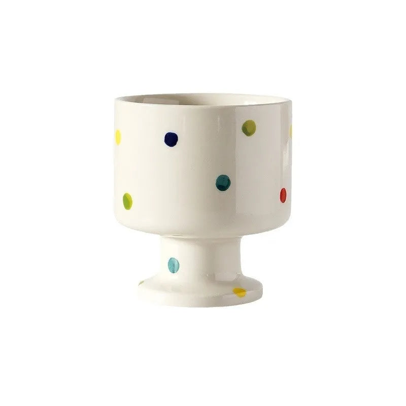 Hand-pinched irregular shaped ceramic mug in a solid colour, modern simple design