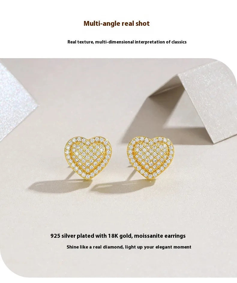 Simple heart-shaped stud earrings made of S925 silver with moissanite, shown in a gold colour.