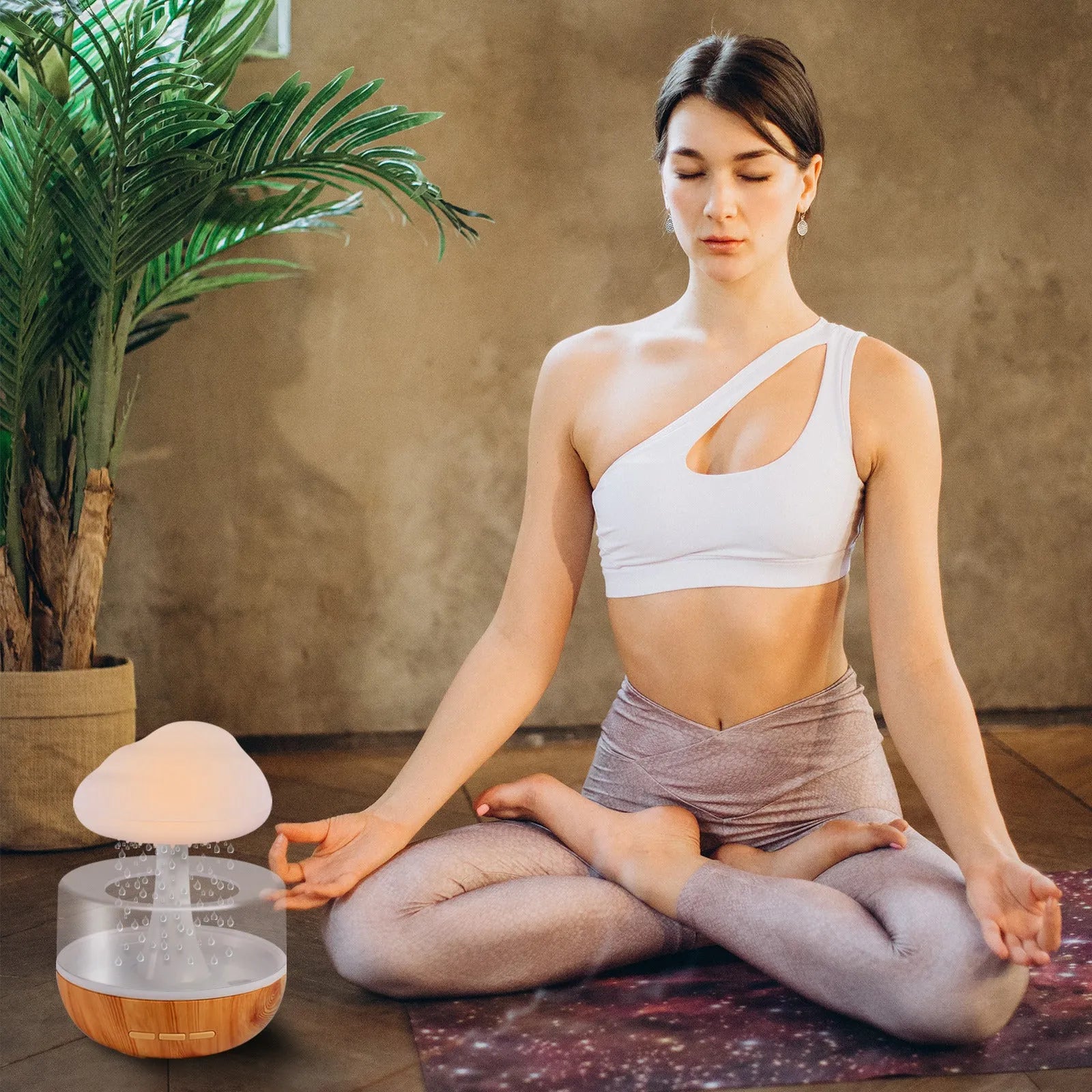 White cloud-shaped humidifier with night light and water flow display on wooden surface