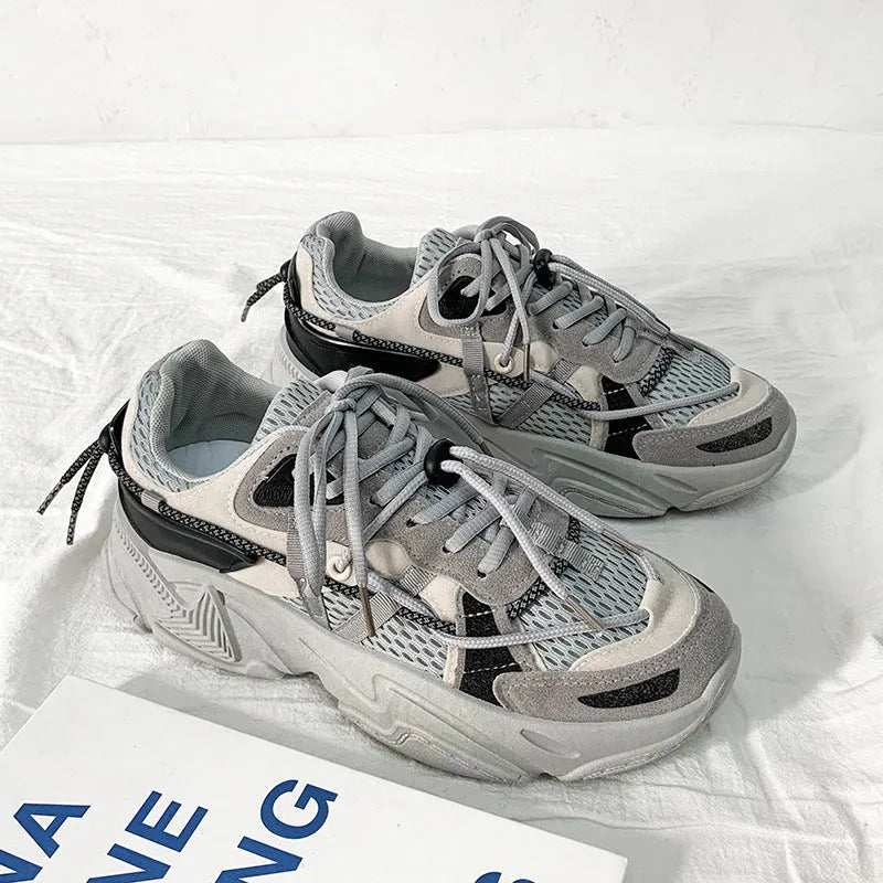 Men's white Korean style platform dad shoes with lace-up front on a neutral background.