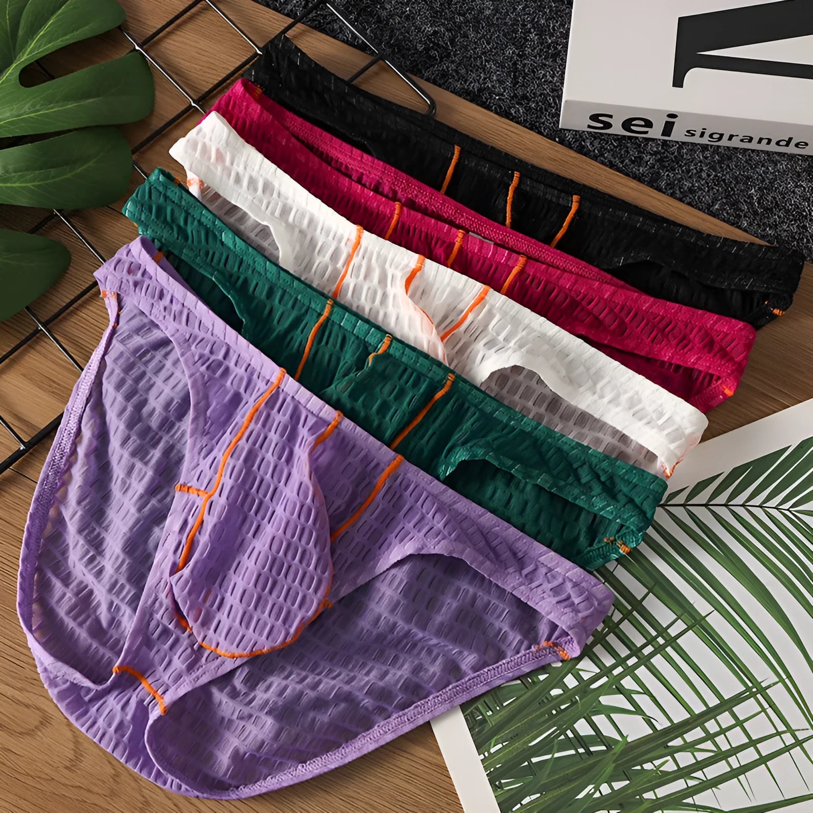 Men's ice silk lace briefs with low waist design in white, black, green, rose red, and light purple colours