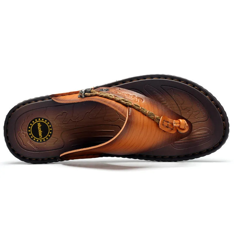 Men's dark blue herringbone patterned outdoor slippers with leather lining and rubber sole, shown in a large size.