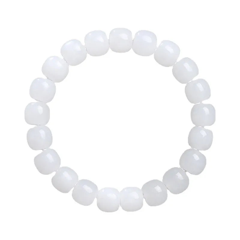 White Hetian jade barrel bead bracelet showing smooth polished beads on wrist