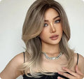 Mid-length platinum gradient synthetic wig with long curly hair and bangs in wine red, brown, or white gold colour.
