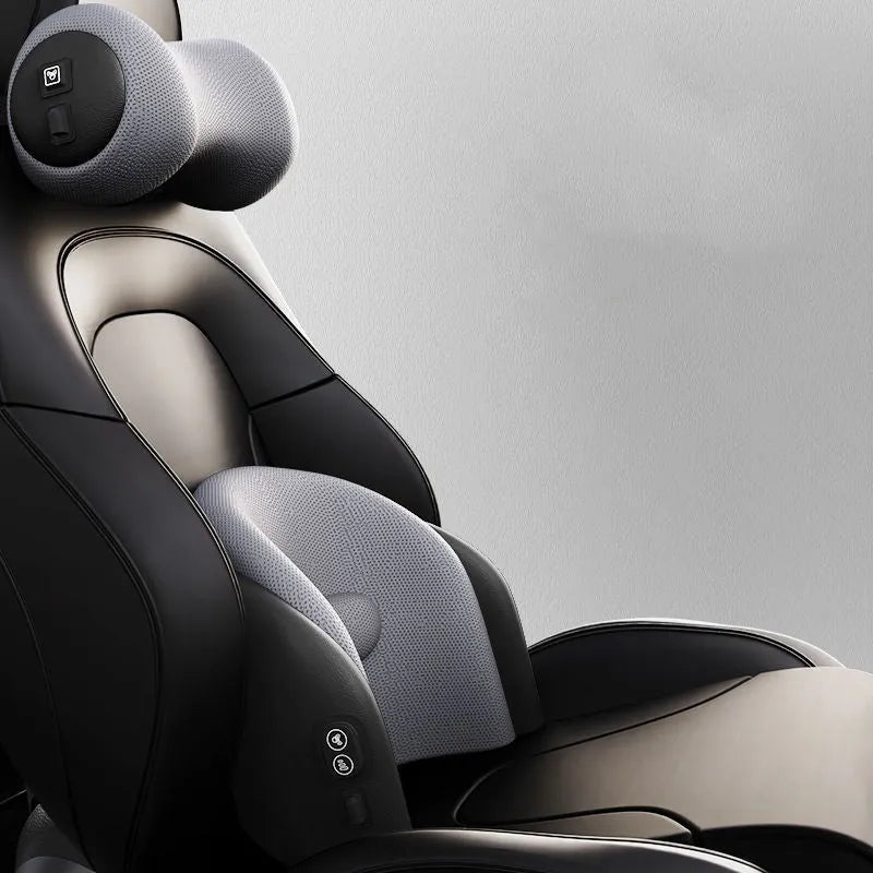 A black car massage cushion with electric vibration controls, placed on a car seat for neck and lumbar support.