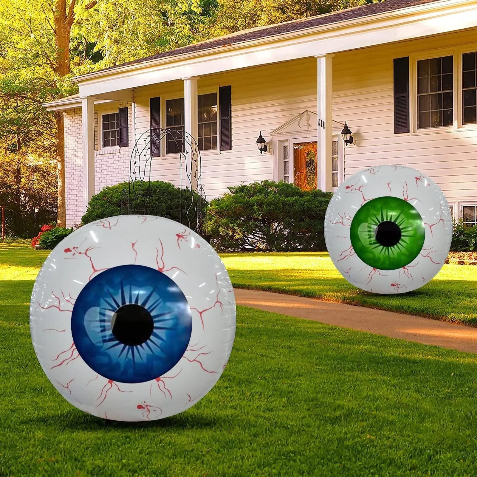 Green Halloween balloon with detailed bloodshot eyeball design, shown inflated.
