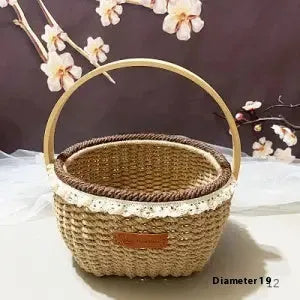 Hand-woven natural straw basket in a light brown colour, measuring 19cm by 12cm.