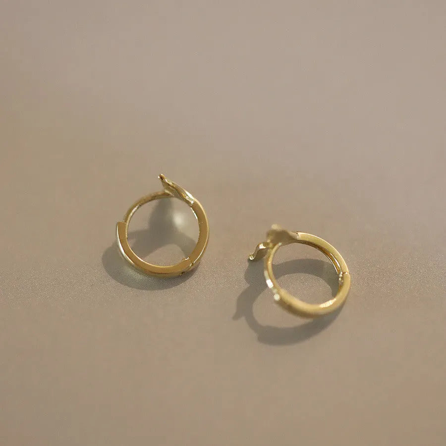 Gold and white gold fishtail hoop earrings made from 925 sterling silver
