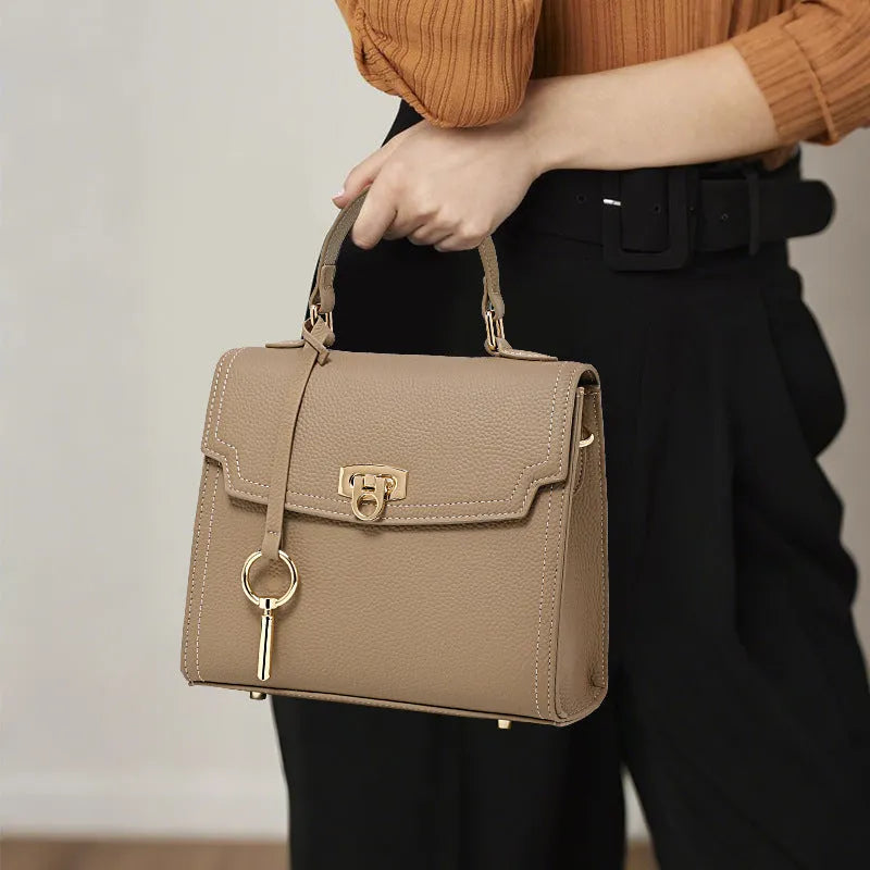 Elephant grey genuine leather crossbody bag with vintage lock and litchi pattern showing square vertical design