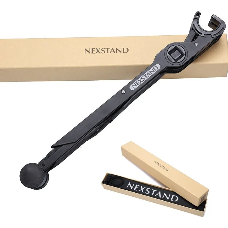 Sagacious black portable folding laptop stand with lifting function on a desk.