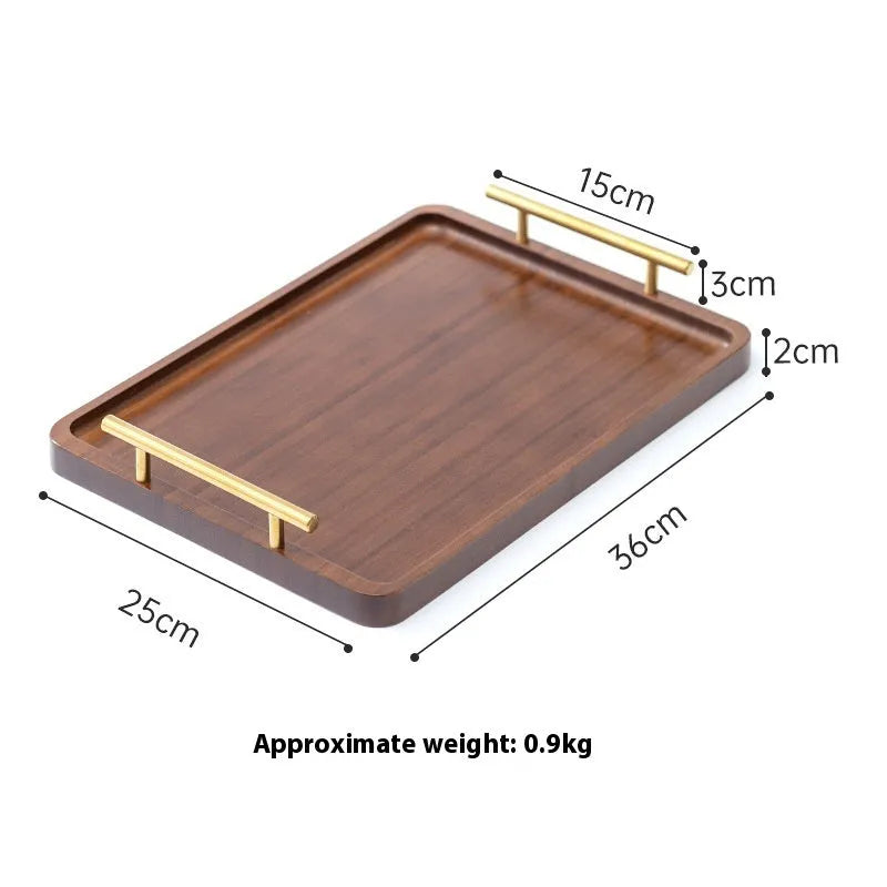 Square bamboo serving tray with brown handle on solid colour surface