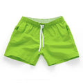 Men's straight-leg polyester beach shorts in black, shown on a model, highlighting the distressed finish and casual fit.