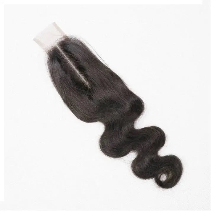 A woman wearing a straight, natural-coloured human hair wig, showcasing its length and realistic texture.