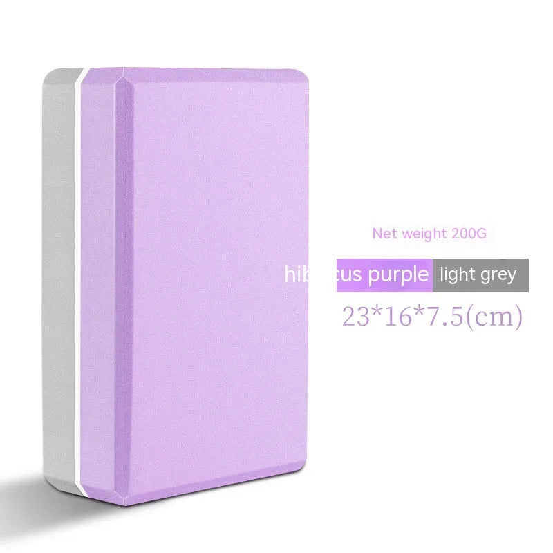 EVA foam yoga block in violet colour, shown next to a pink block, demonstrating its size and rectangular shape for fitness support.