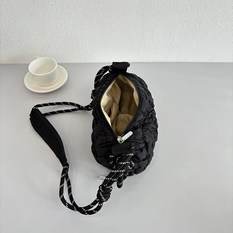 Women's soft nylon messenger bag in pillow shape with rhombus pattern and crossbody strap.