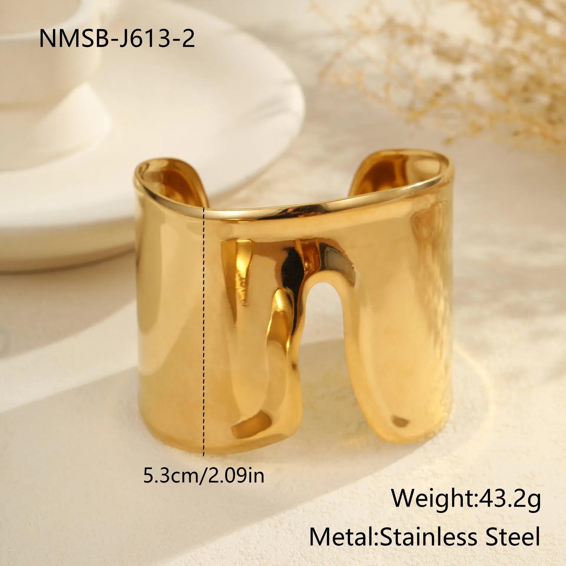 Women's fashion bracelet with exaggerated width, geometric wave patterns, and gold plating