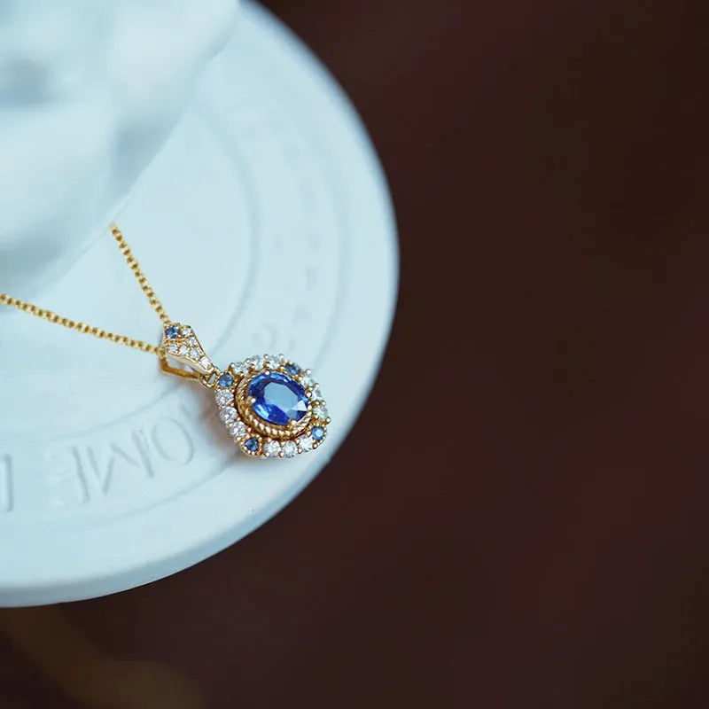 Women's royal style necklace with mixed gem pendant on adjustable yellow gold chain