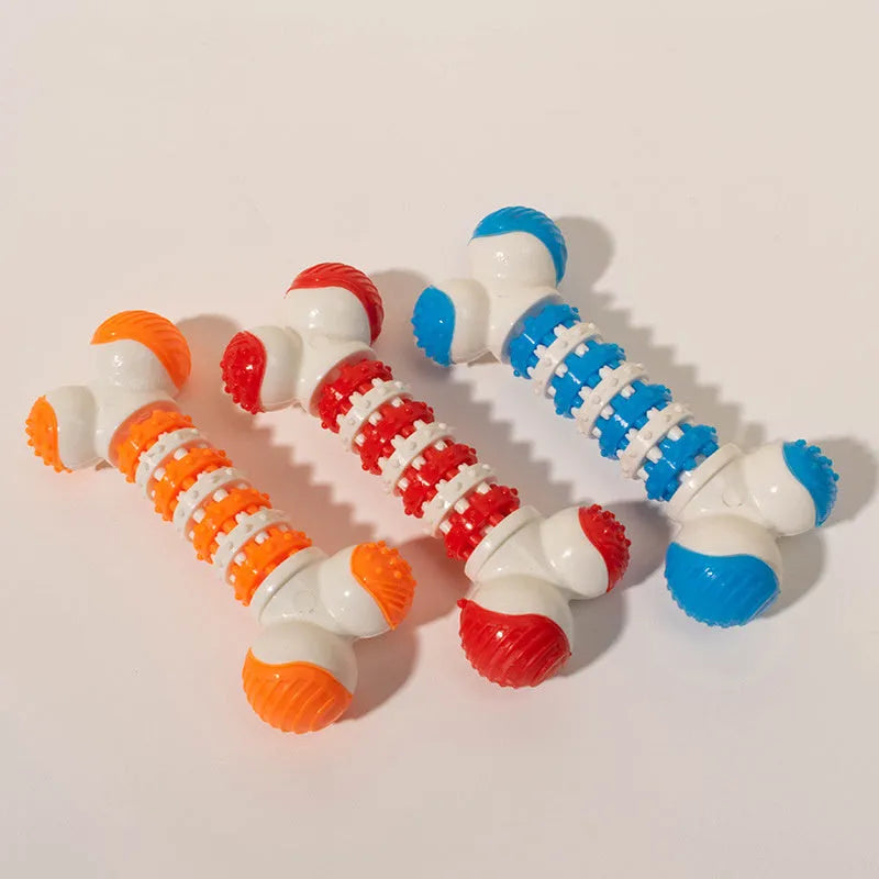 Blue bone-shaped rubber dog toy with a treat holder in the centre, shown next to dog biscuits.