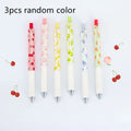 Three fruit scented press-action pens with 0.5mm quick-drying black refills on white background