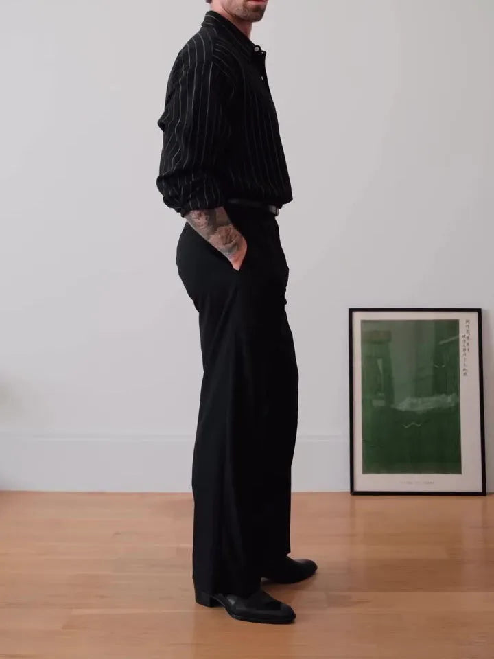 Black pinstriped polyester button-down shirt for men on a hanger, showing regular fit.