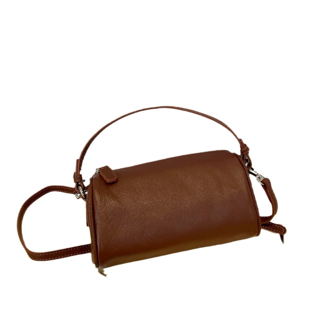 Cylindrical leather crossbody phone bag in vegetable tanned genuine leather with sewing thread detailing