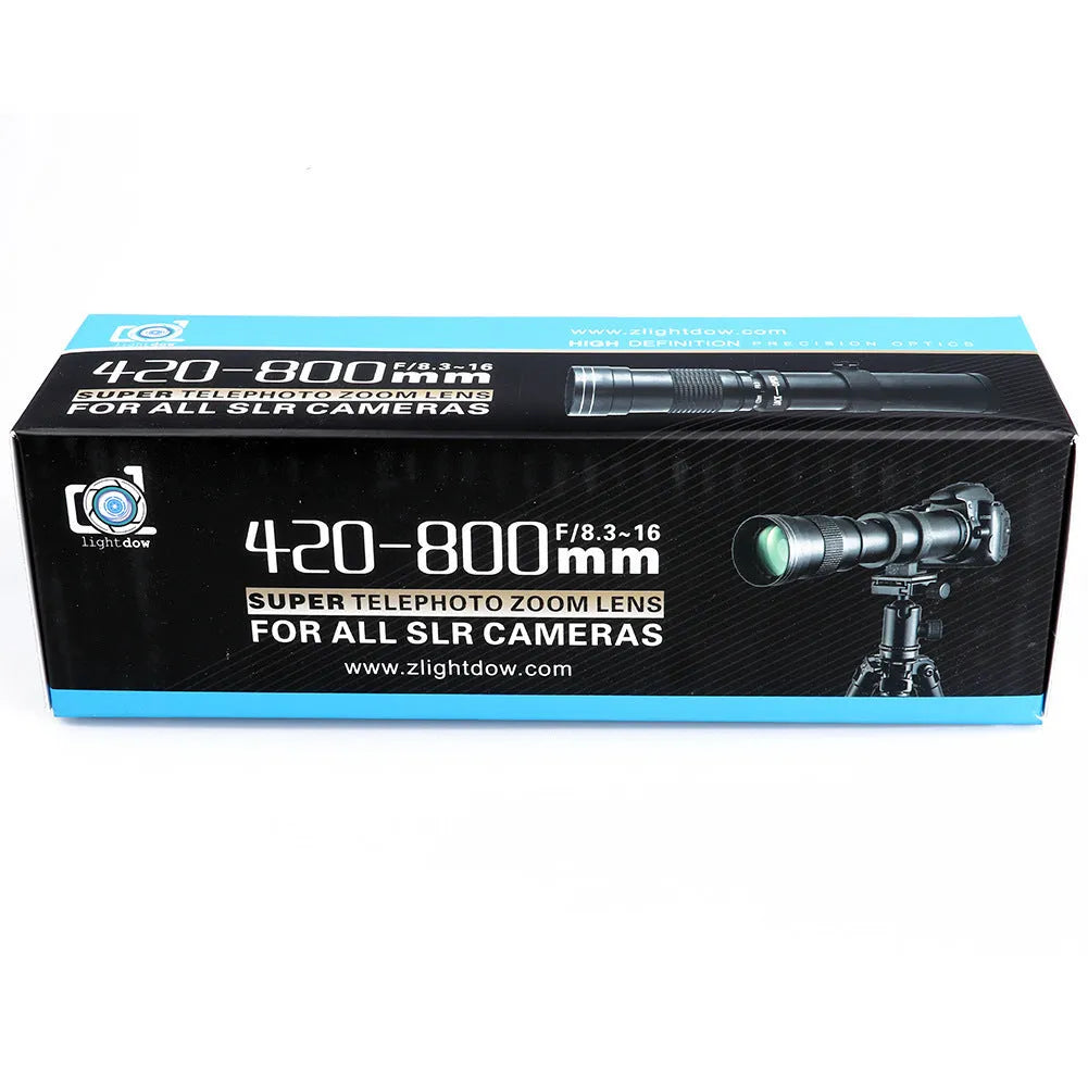 420-800mm manual telephoto zoom camera lens with T-port adapter ring on a table