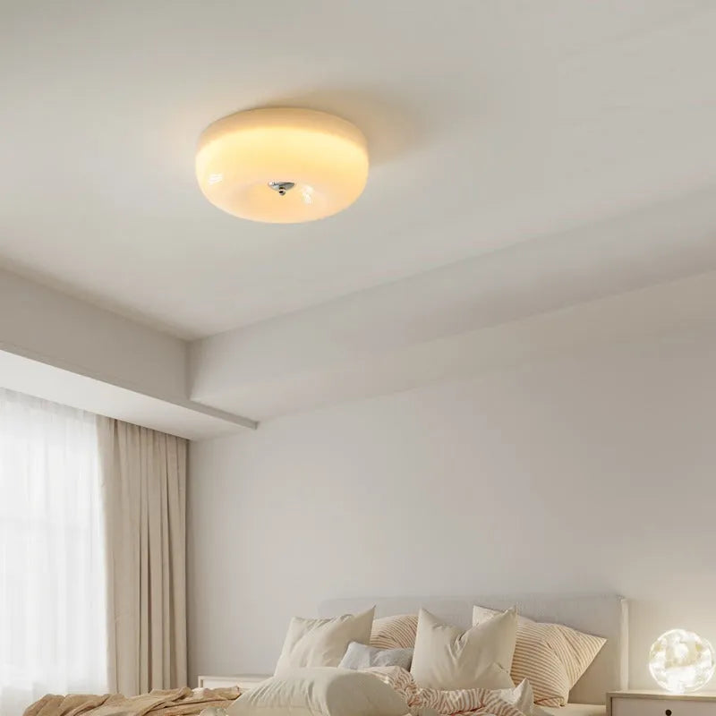 Cream American-style bedroom ceiling lamp with three-colour light mounted centrally