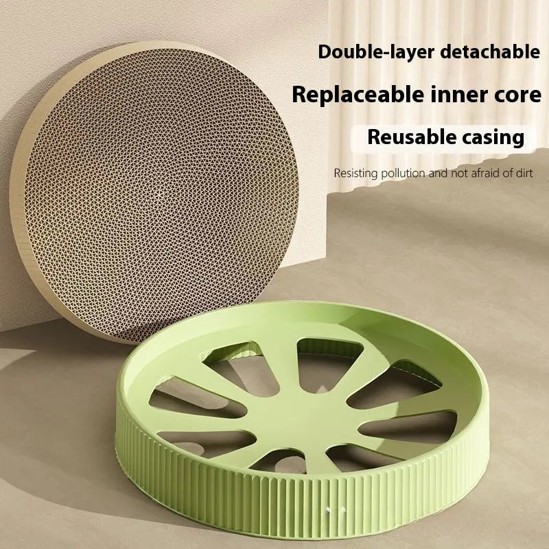Round green cat scratching board with replaceable corrugated centre measuring 55 cm diameter