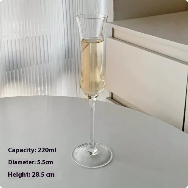 Six French crystal champagne glasses in various designs on dining table