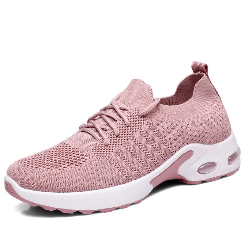 Women's casual mesh sneaker in black with lace-up front and round toe on a soft PVC sole.