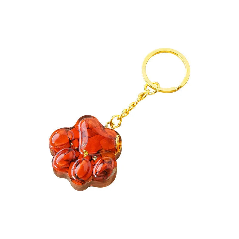 Small natural crystal cat's paw pendant on a metal keyring, available in various stone colours.