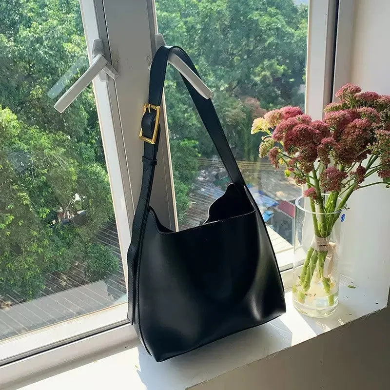 Soft PU leather shoulder bag with swing threads decoration in black or brown colour