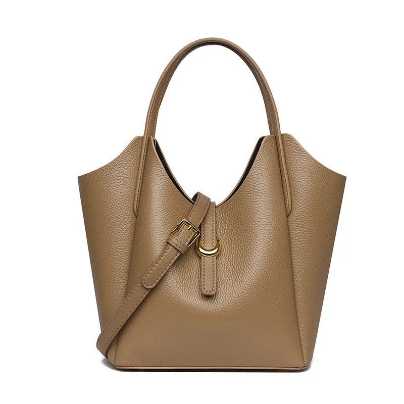 Genuine leather retro bucket handbag for women in beige, showing sewn thread detail and handheld straps.