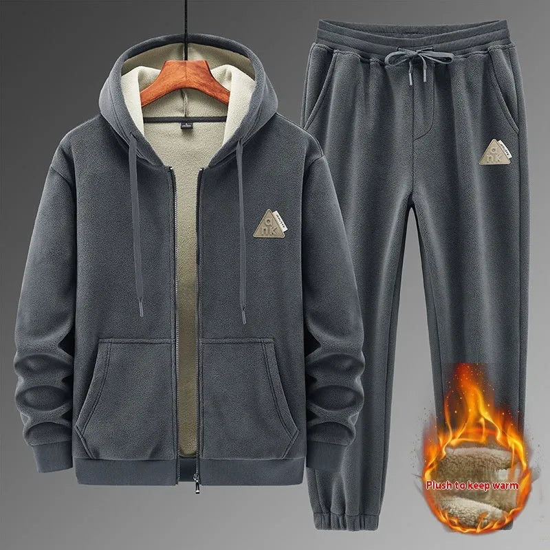 Men's grey hooded sports sweater and matching trousers laid flat.