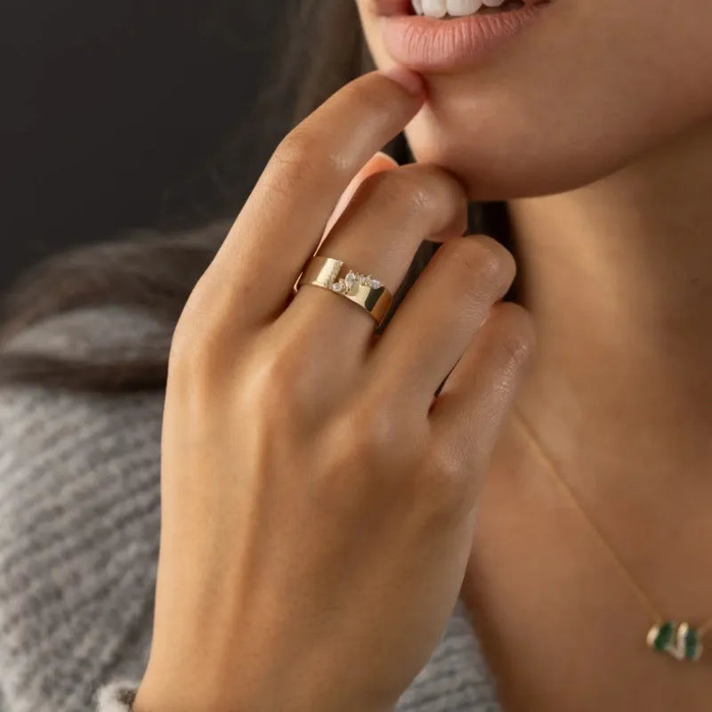Women's gold electroplated ring with shining zircon stones on copper band