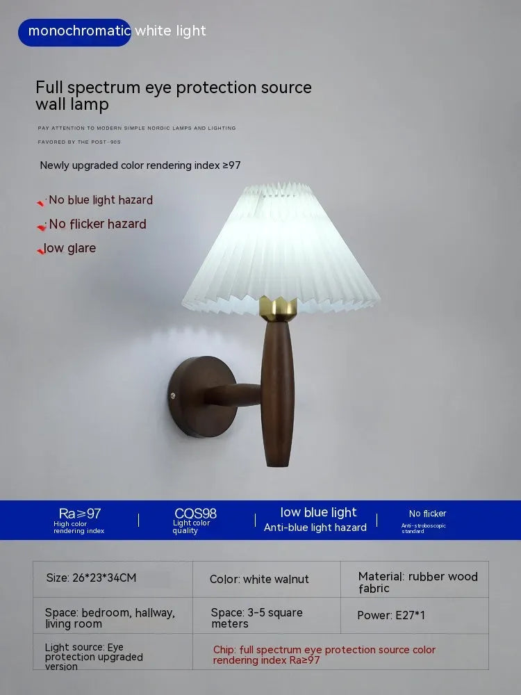 American retro style wall lamp with a walnut wood base and white fabric shade mounted on a wall.