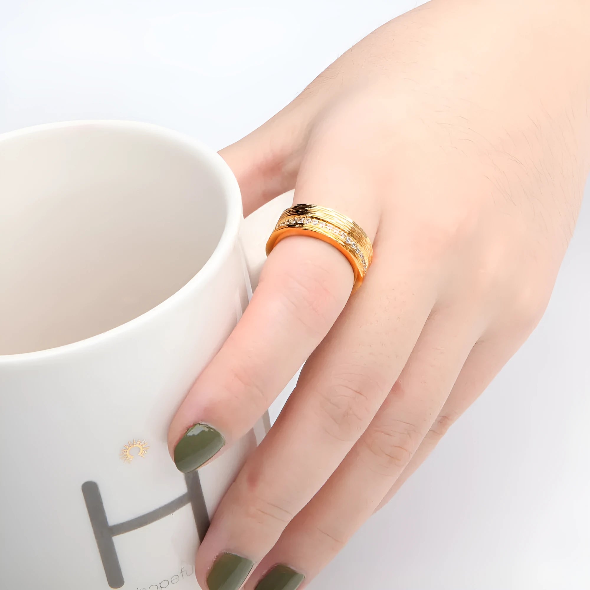 Gold geometric zircon ring for women on a copper base, showing angular design.