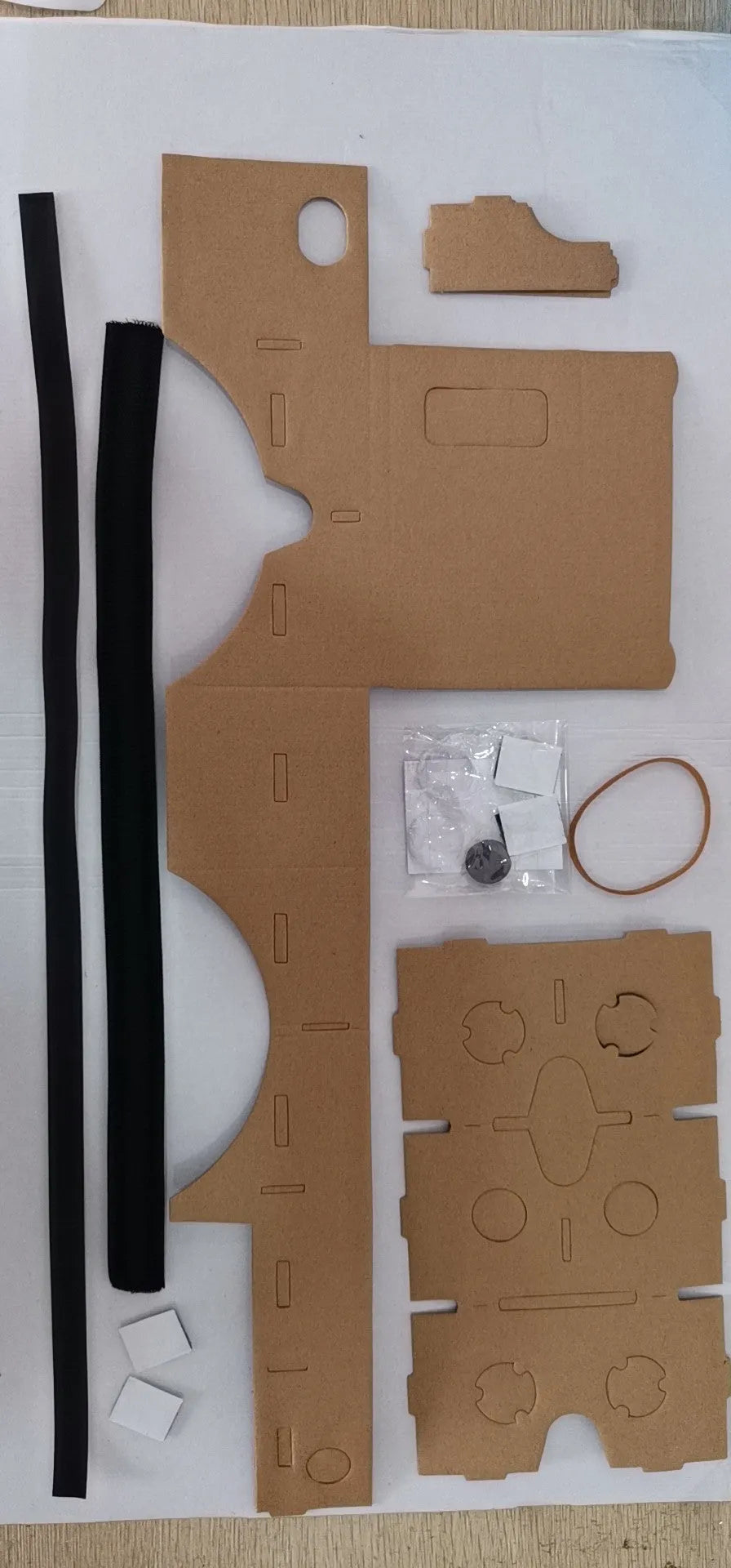 Pink and white VR cardboard glasses viewer for 6-inch smartphones with adjustable head strap.