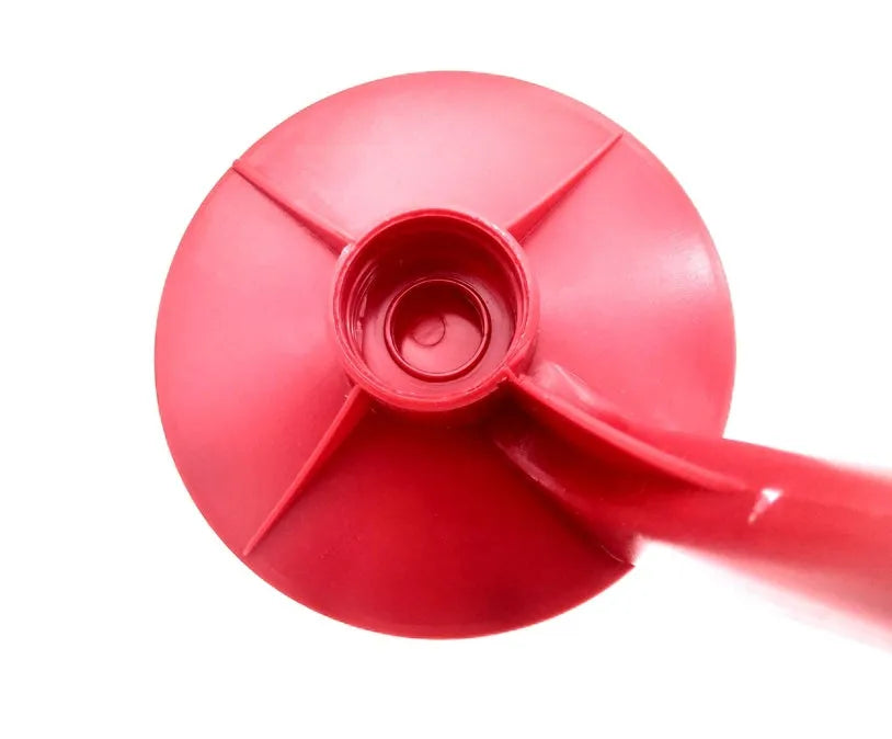 Red plastic Magic Tap soda dispenser attached to inverted 2-litre bottle