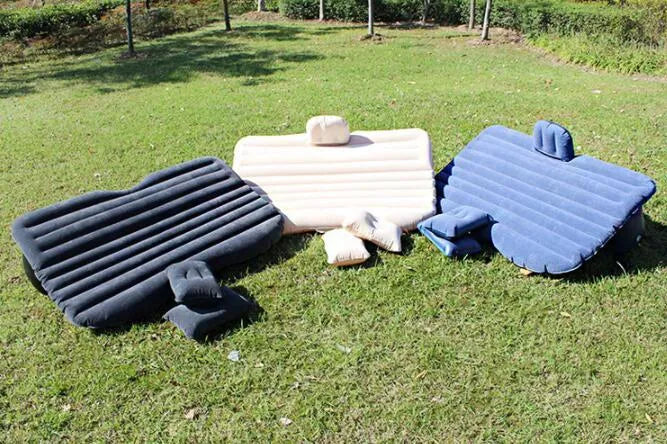 Universal inflatable car bed with flocking material, shown with pump, pillows, and storage bag.