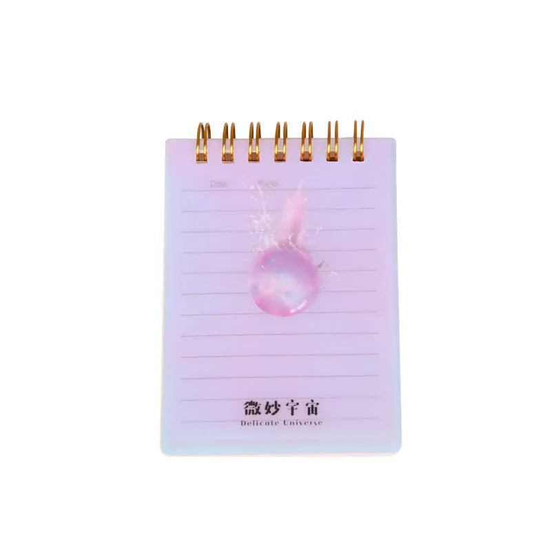 A7 spiral notebook with PP cover showing constellation design, spiral binding, and open page with square inner core