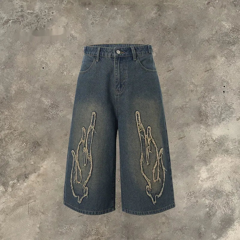 Men's cropped denim shorts with flame embroidery patch in straight leg cut
