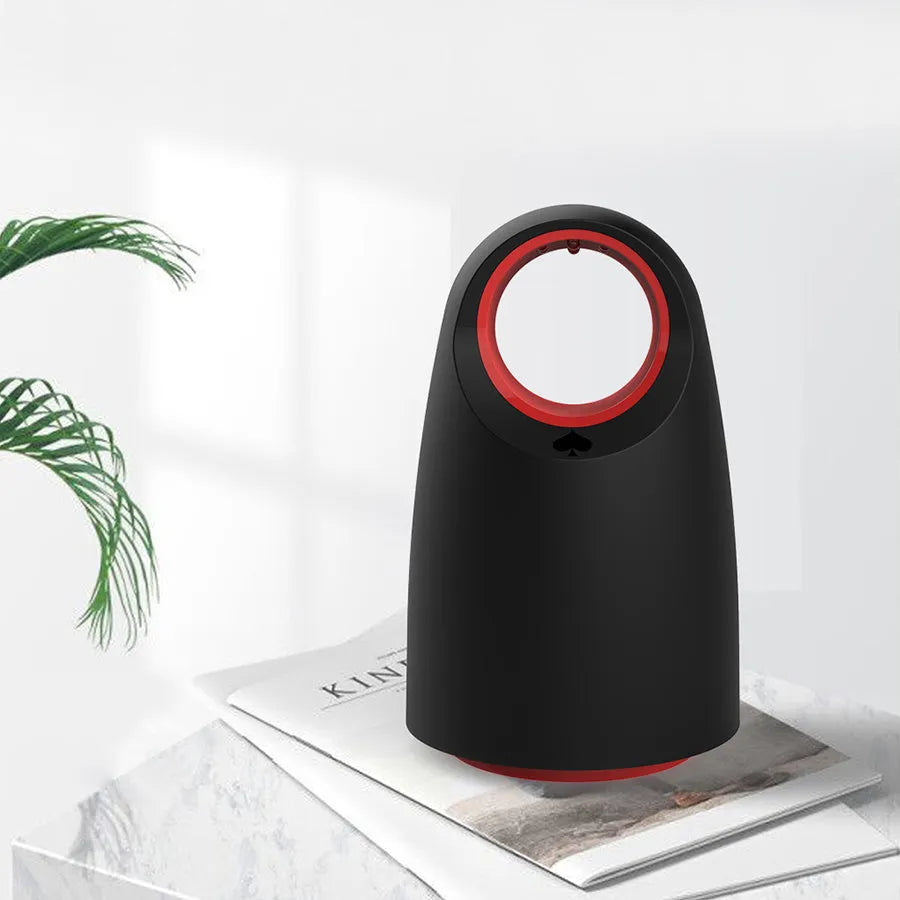 Black or white coloured silent electric mosquito killer with USB cable on a table.