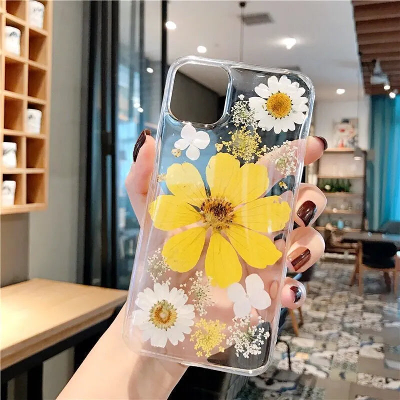Floral TPU phone case with large pink flower design on back, shown fitted on an iPhone.
